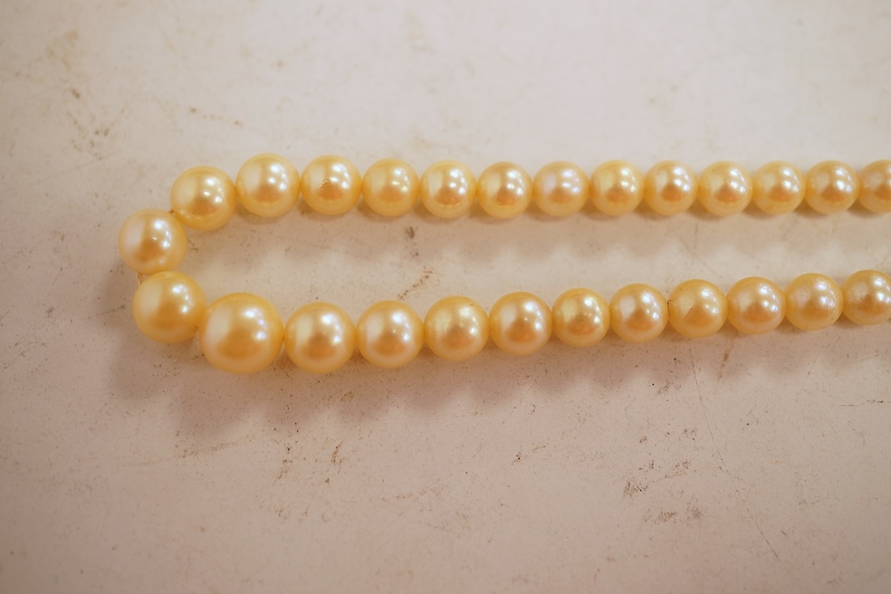 Two cultured pearl necklaces, each composed of a single row of cultured pearls, one with pearls 3-7mm diameter, length 44cm, clasp stamped 9CT; the other with pearls approximately 6mm diameter, length 86cm, clasp with Br